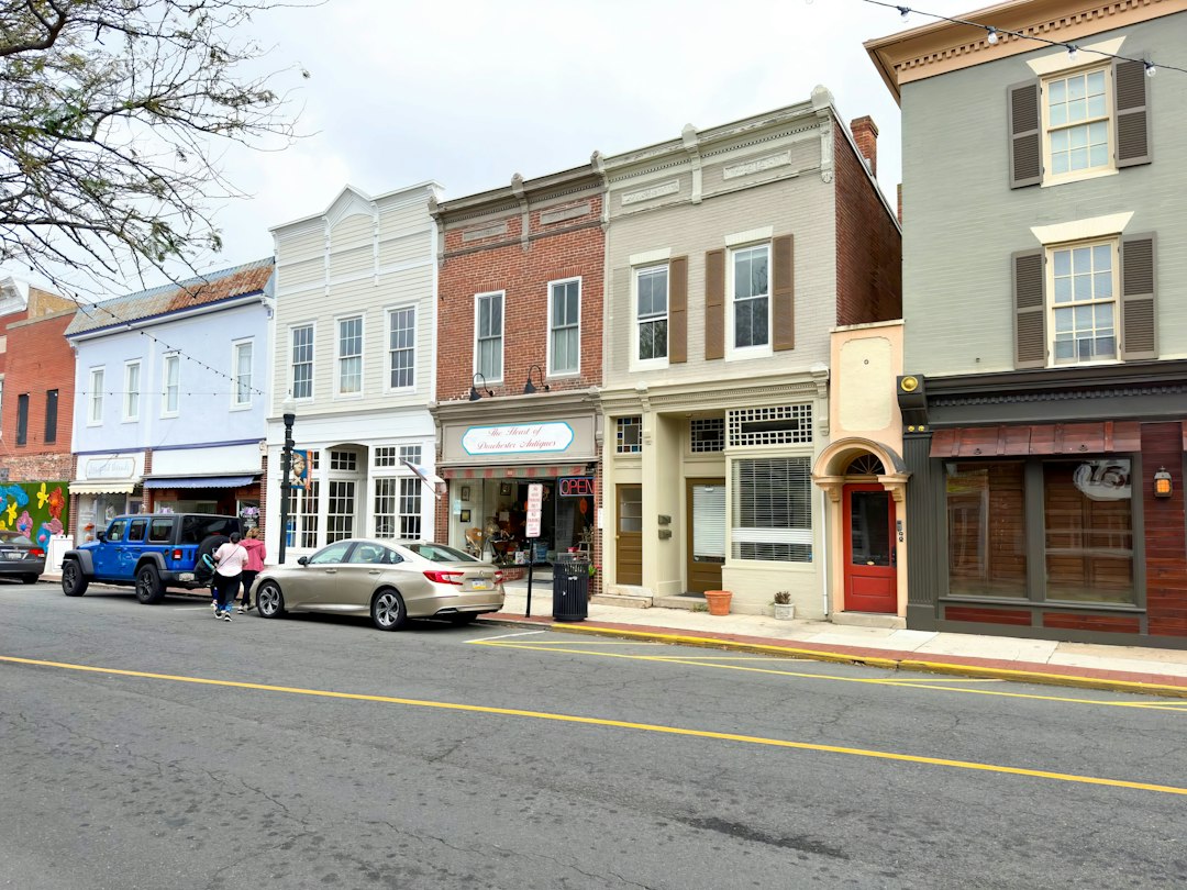 Street-level view of brick storefronts in a small American town